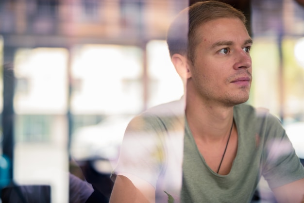 Portrait of handsome man relaxing in the coffee shop