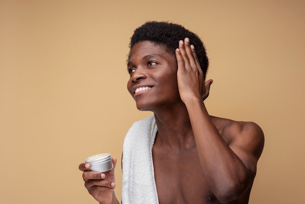 Portrait of a handsome man styling his hair