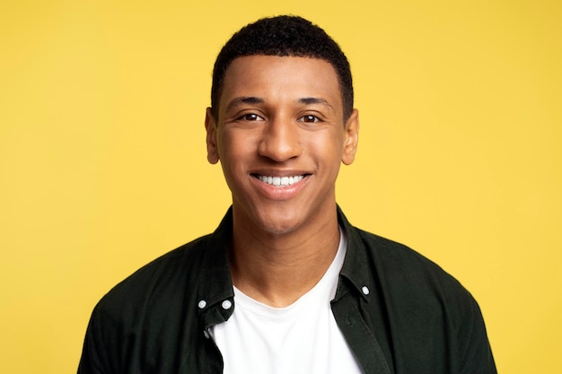 Portrait of handsome man wearing casual style shirt posing with positive facial expression