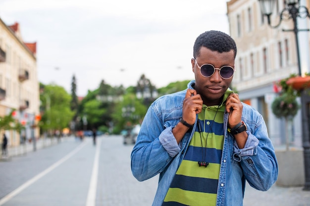 Portrait of handsome model boy posing in sunglasses