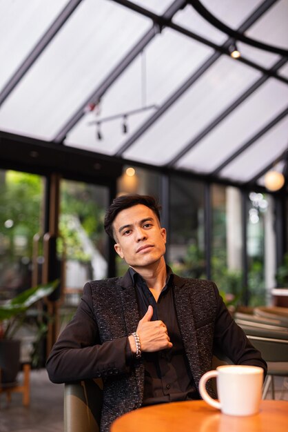 Portrait of handsome young businessman at coffee shop