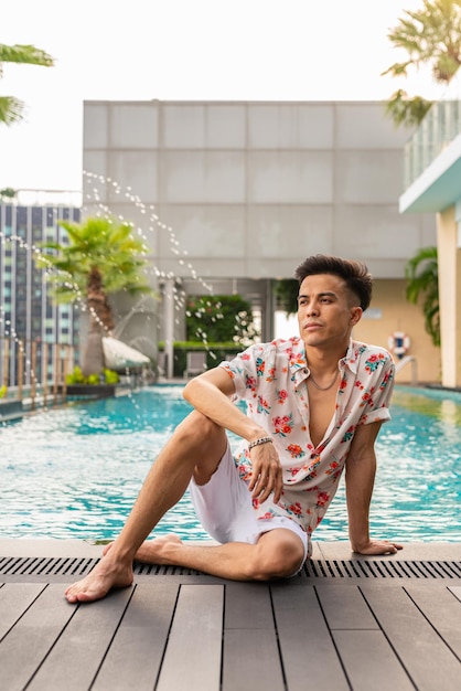 Portrait of handsome young cool man enjoying summer