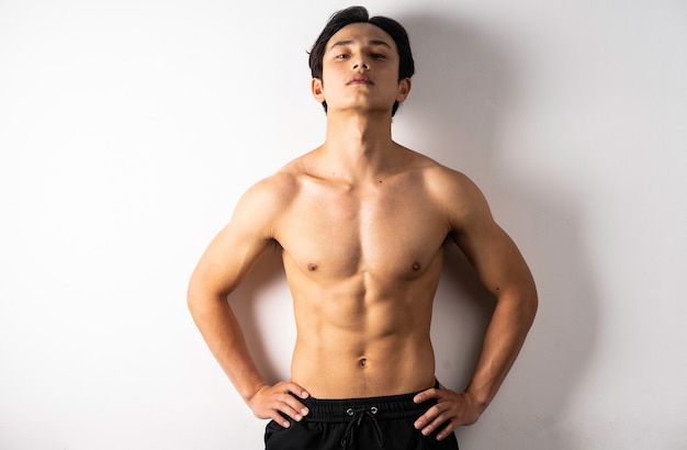 Portrait of handsome young man with clean muscles and skin