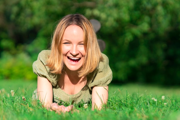 Portrait of happy cheerful positive joyful teen girl young beautiful woman is having fun laughing