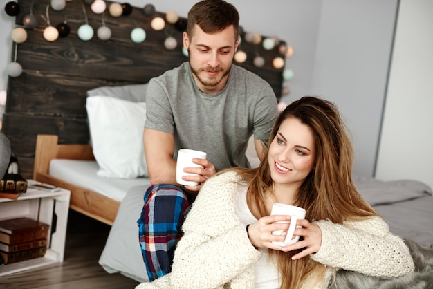 Portrait of happy couple drinking coffee