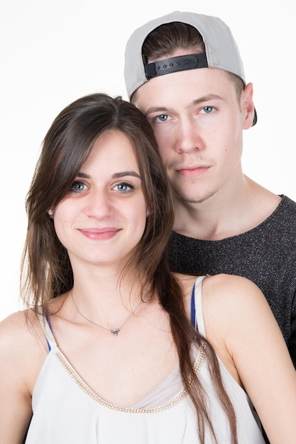 Portrait of happy couple isolated on white background. Attractive man and woman being playful.