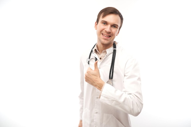 Portrait of happy doctor in white medical coat showing gesture all is well isolated on white background with copy space