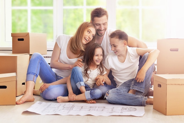 Portrait of happy family in new home