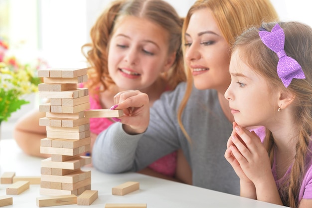 Portrait of a happy family playing with blocks together