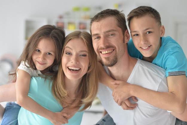 Portrait of happy family posing at home