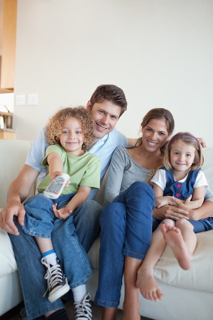 Portrait of a happy family watching TV together