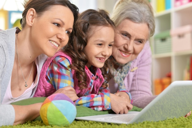 Portrait of happy family with laptop