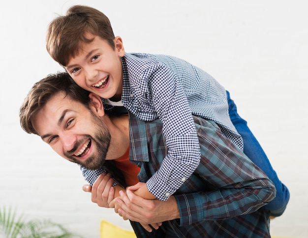 Portrait of happy father embraced by his son