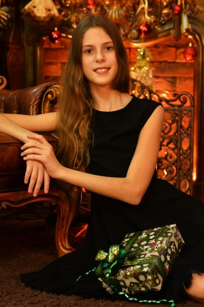 Portrait of happy girl with gift on Christmas