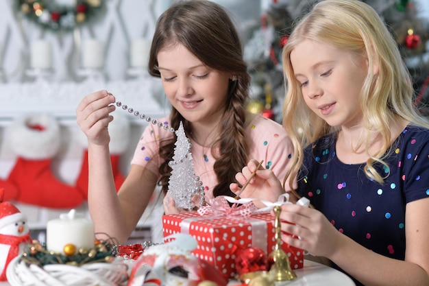 Portrait of happy girls  preparing for Christmas