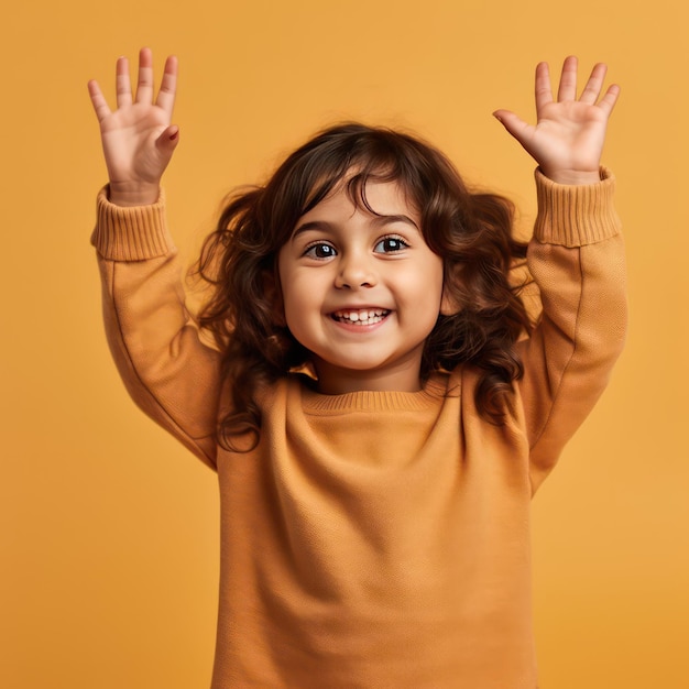 Portrait of a happy little girl showing ok gesture smiling