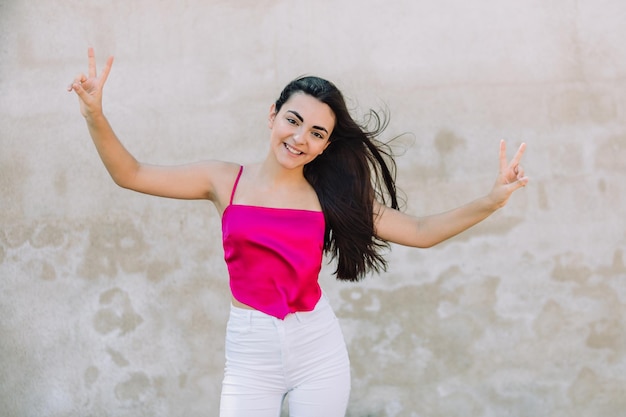 Portrait of a happy lovely and beautiful Spanish young woman in a park