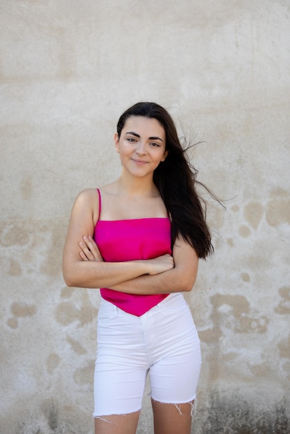 Portrait of a happy lovely and beautiful Spanish young woman in a park