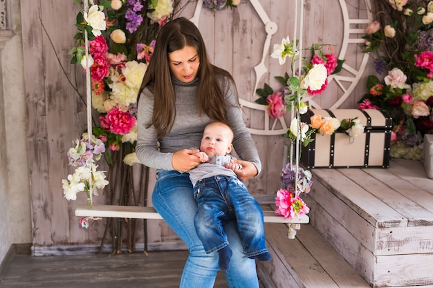 Portrait of happy loving mother and her baby boy indoors