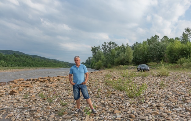 Portrait of a happy man in nature.