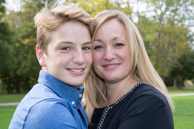 Portrait of happy mother and son at sea outdoor