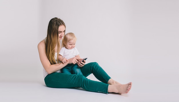 Portrait of happy mother with her little baby