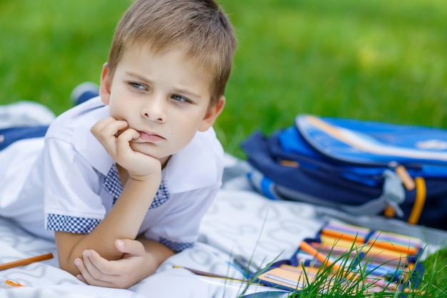 portrait of happy school kid is going to school for the first time