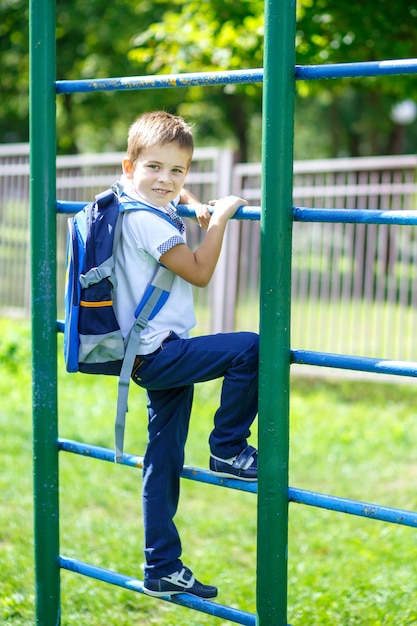 portrait of happy school kid is going to school for the first time