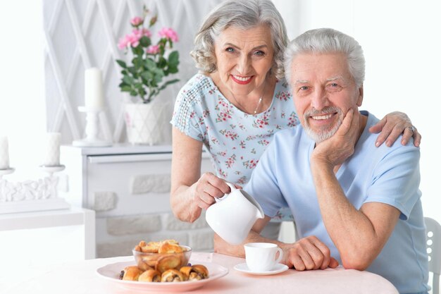 Portrait of happy senior couple drinking tea