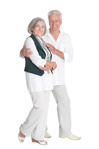 Portrait of happy senior couple embracing isolated