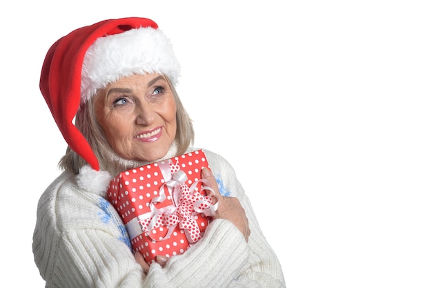 Portrait of happy senior woman with Christmas gift