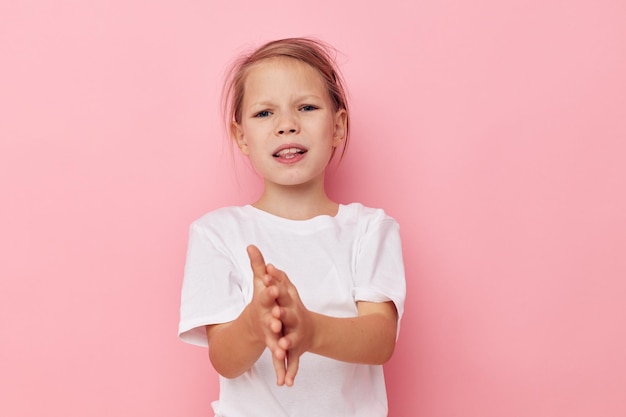 Portrait of happy smiling child girl emotion hands gesture childhood unaltered