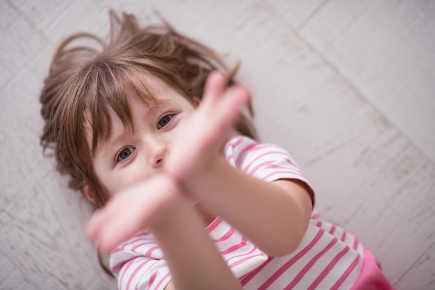 portrait of happy smiling child at home while playing