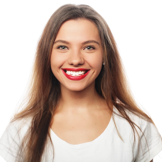 Portrait of happy smiling young beautiful woman, isolated over white background