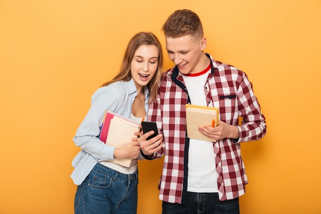 Portrait of a happy teenage school couple