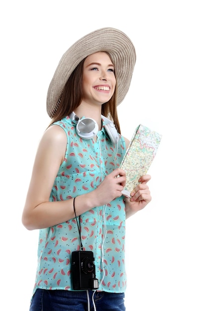 Portrait of happy tourist woman holding map on holiday on white