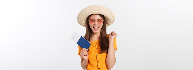 Portrait of happy tourist woman holding passport on holiday on white background