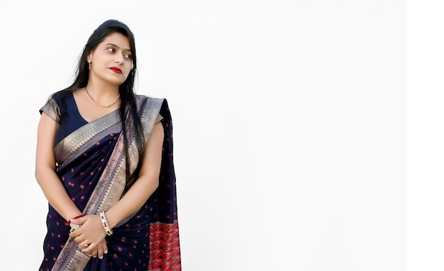 Portrait of a happy woman of Indian origin wearing traditional dress sari