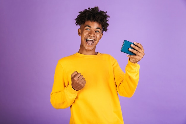 Portrait of a happy young afro american man isolated