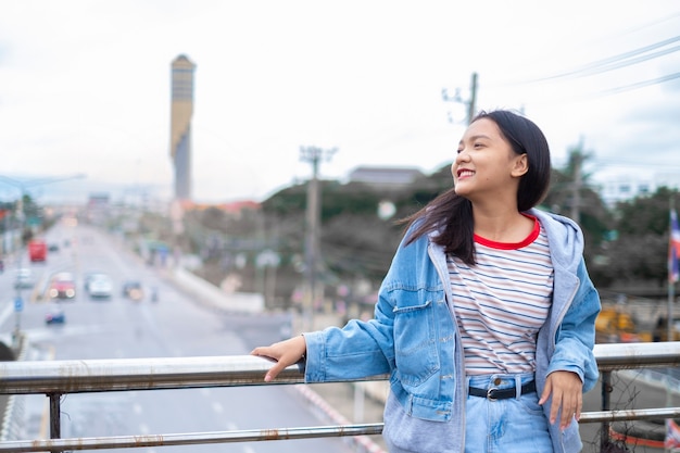 Portrait happy young asian girl, smile girl out door.