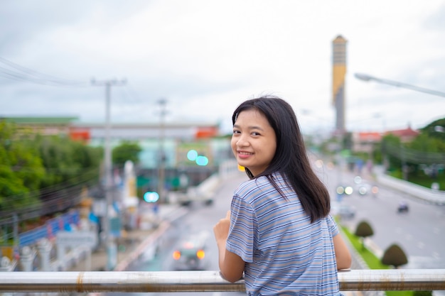 Portrait happy young asian girl, smile girl out door.