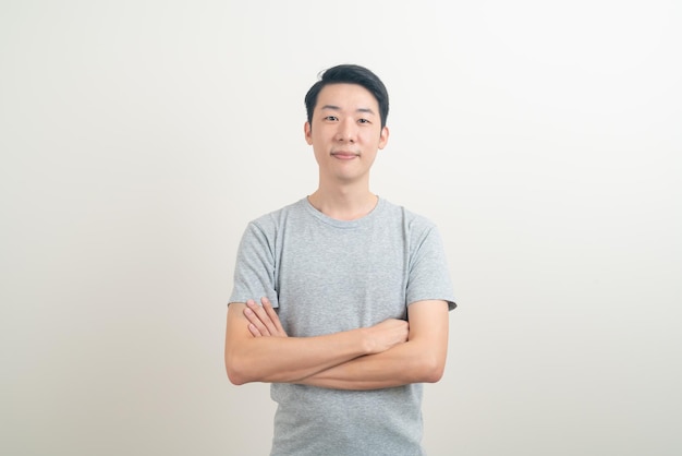 portrait happy young Asian man smiling on white background