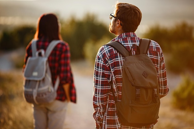 Portrait of happy young couple having fun on their hiking trip