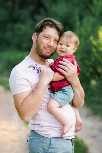 Portrait of a happy young dad and a baby son