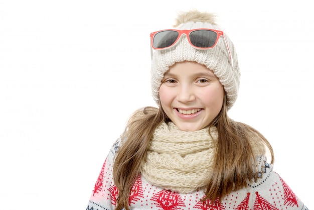 Portrait of a happy young girl snowboarding