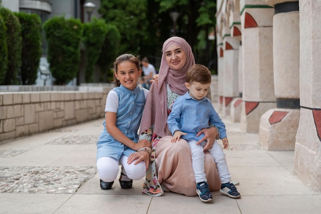 Portrait of a happy young Muslim family outdoor Happy diverse family lifestyle