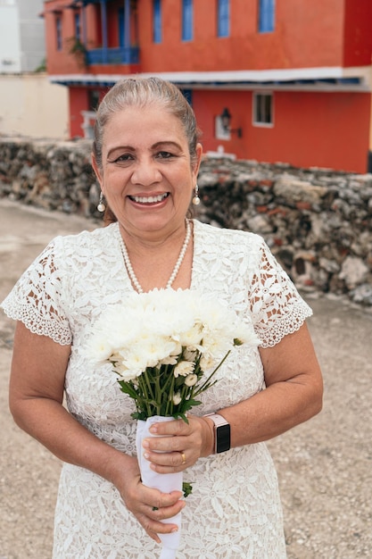 Portrait of the Hispanic bride holding the bouquet