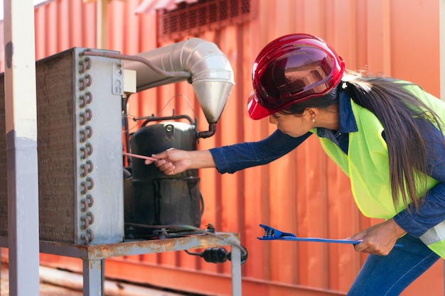 Portrait of Hispanic Female Industrial Worker Working in a Factory