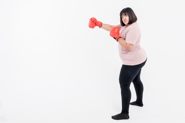 Portrait images of Asian fat woman Wearing red boxing gloves