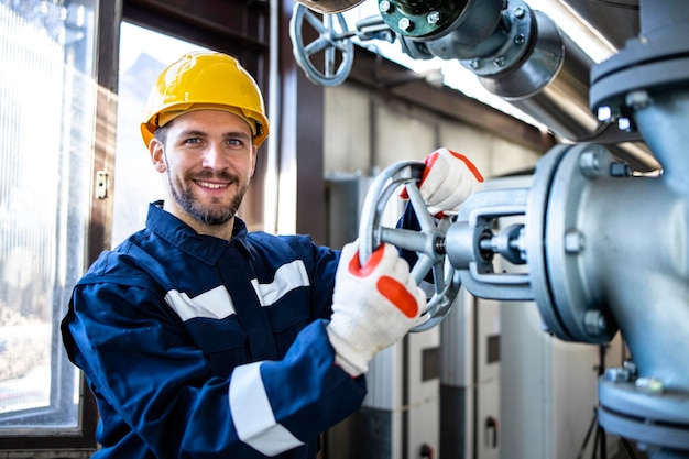 Portrait of industrial worker inside gas and oil refinery